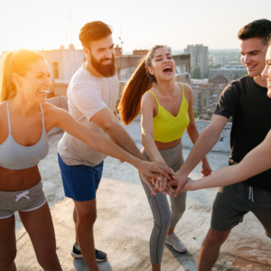 Group of people walking together in the sunshine for Sport & Spine Physical Therapy's blog on fitness and wellness.