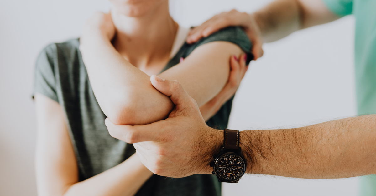 Patient working with a physical therapist during post surgical recovery session at Sport & Spine.
